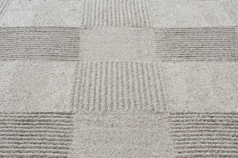Grid pattern of raked gravel at a temple
