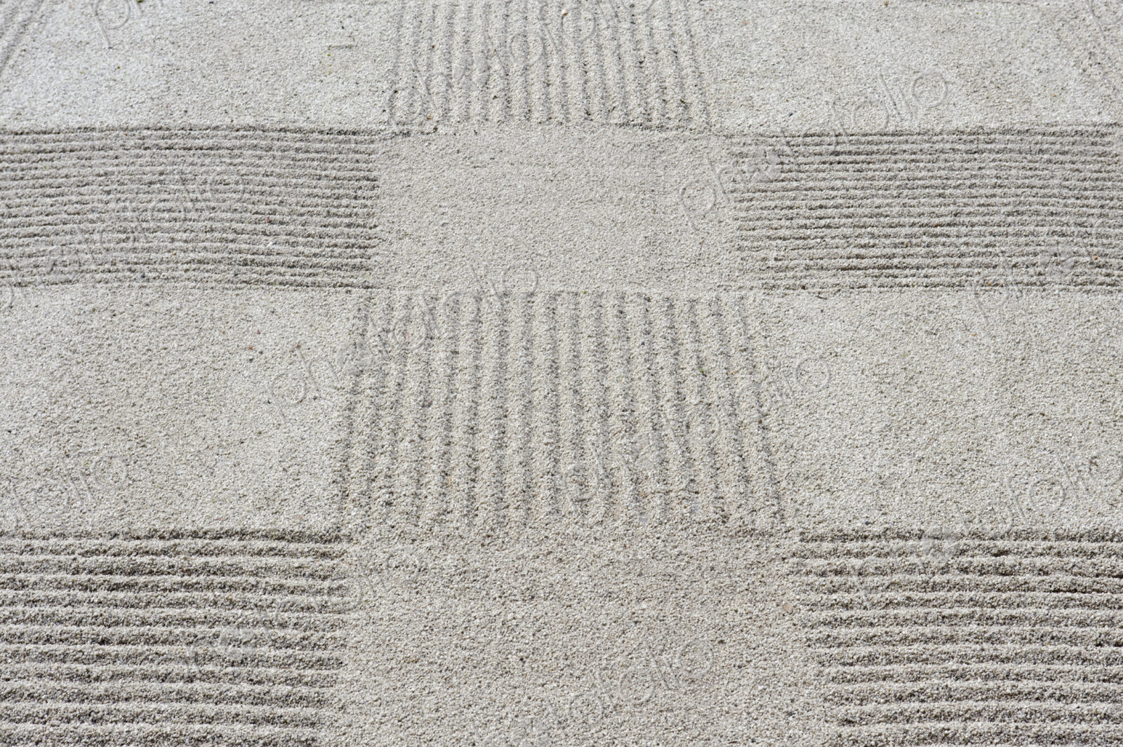 Grid pattern of raked gravel at a temple