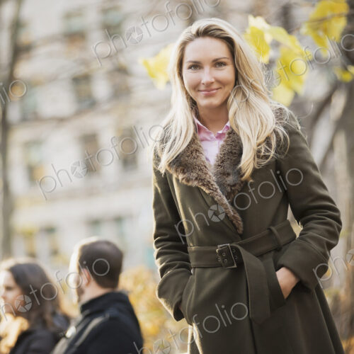 Group on bench in urban park, woman in front Group on bench in urban park, woman in front