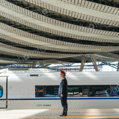 Guard by Maglev train in the railway station, Beijing, China Guard by Maglev train in the railway station, Beijing, China