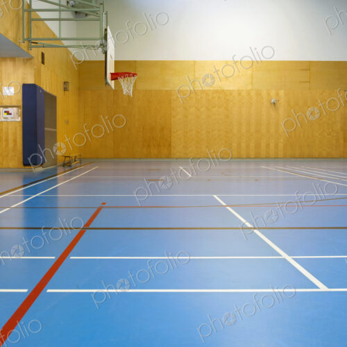 Gymnasium and basketball court, large empty gym.