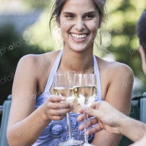 HIspanic couple having a healthy meal and a glass of white wine. HIspanic couple having a healthy meal and a glass of white wine.