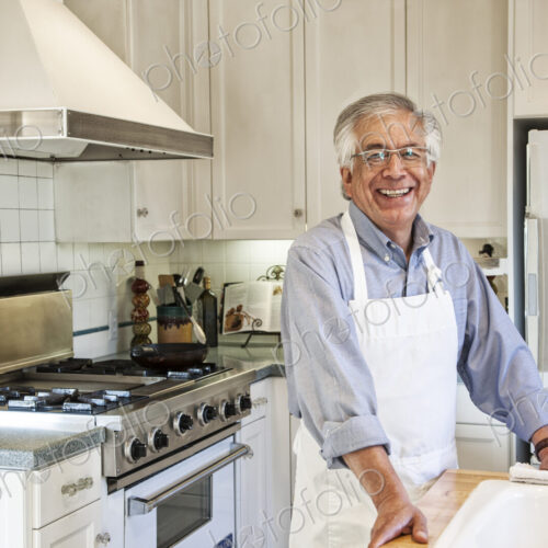 HIspanic senior man in his remodeled kitchen HIspanic senior man in his remodeled kitchen