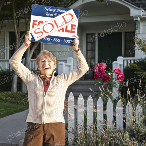 HIspanic seniors in front of their newly puchased remodeled older style home. HIspanic seniors in front of their newly puchased remodeled older style home.