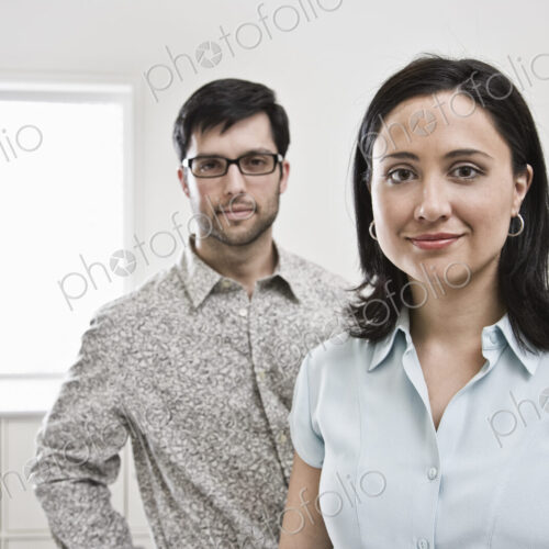 HIspanic woman and man in office. HIspanic woman and man in office.