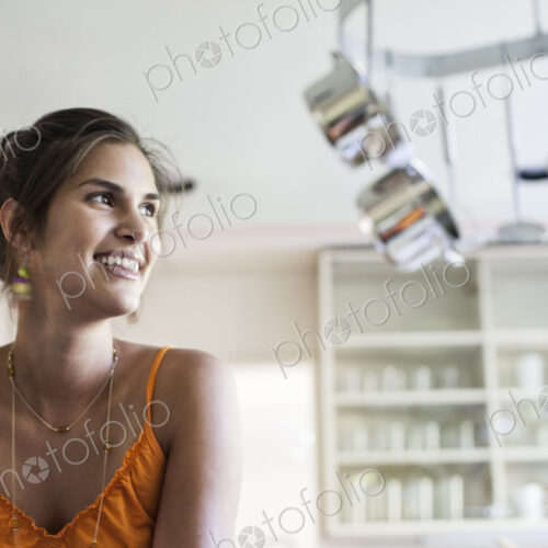 HIspanic woman at home in the kitchen.