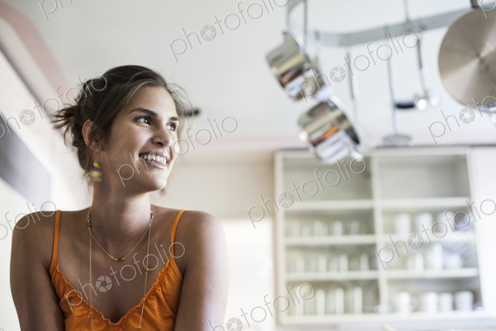HIspanic woman at home in the kitchen.