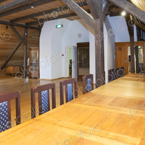 Hallway in a converted farm building, central chimney and mezzanine floors under…