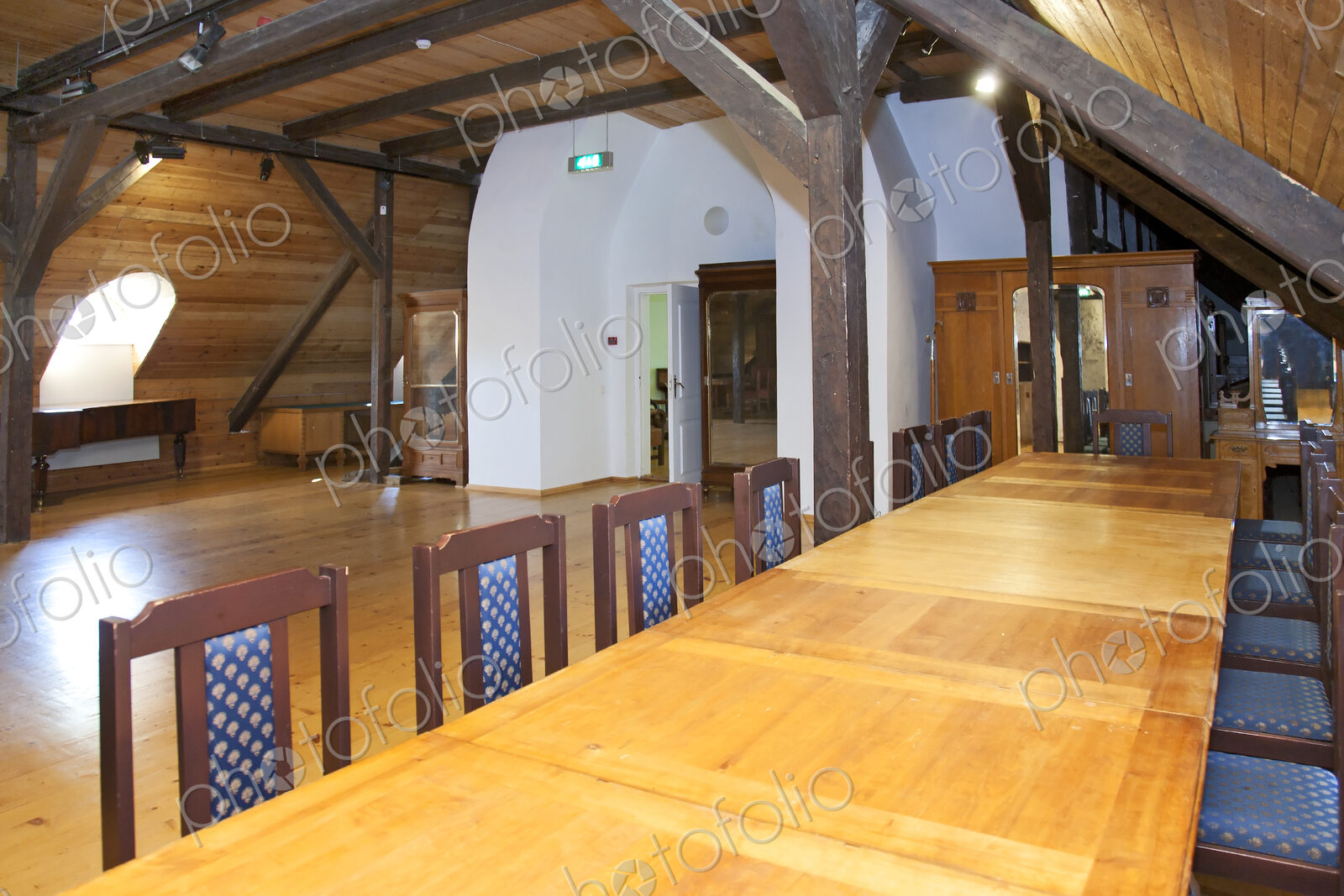 Hallway in a converted farm building, central chimney and mezzanine floors under…