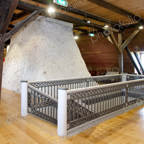 Hallway in a converted farm building, central chimney and mezzanine floors under…