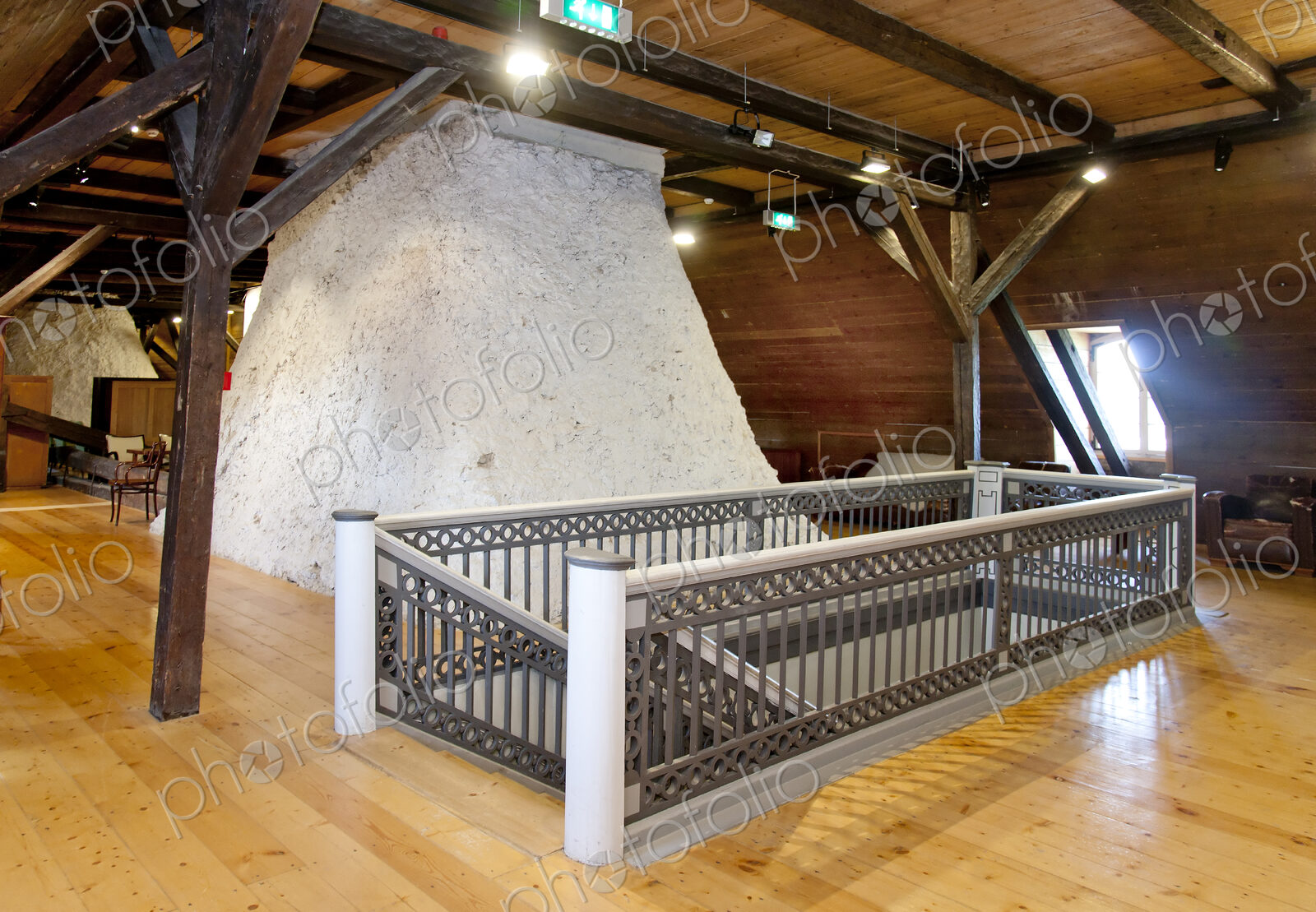 Hallway in a converted farm building, central chimney and mezzanine floors under…