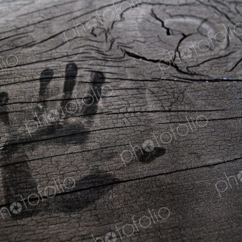Hand print on wooden surface. Hand print on wooden surface.