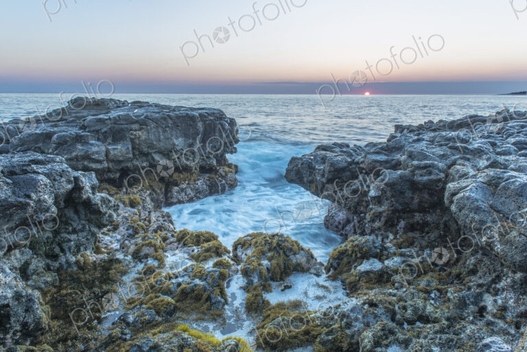 Hawaii, Kauai, Mokolea Point, the coastline and view out to sea at dawn.
