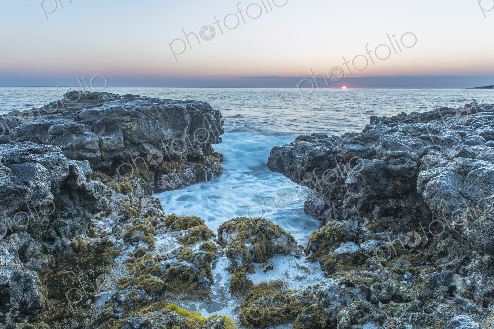 Hawaii, Kauai, Mokolea Point, the coastline and view out to sea at dawn.