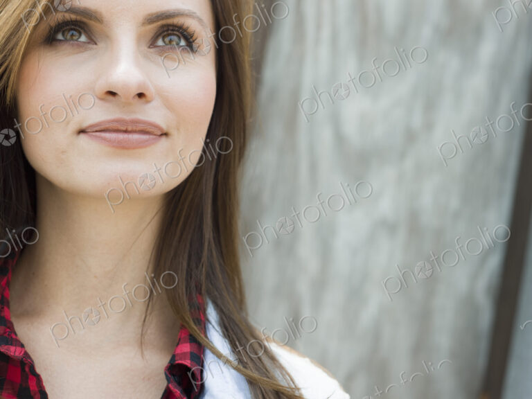 Head and shoulders portrait of a smiling woman.
