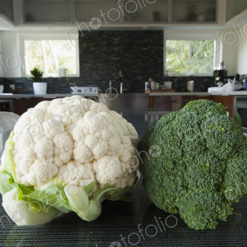 Head of Broccoli and Cauliflower on a Table Head of Broccoli and Cauliflower on a Table