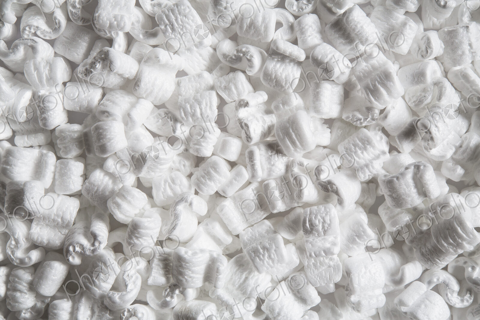 Heap of packaging shapes, white polystyrene material.