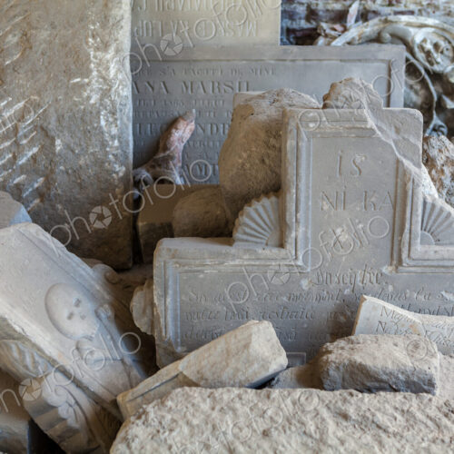 Heaps of stones with inscriptions in Pelus Castle, broken gravestones and carved bas… Heaps of stones with inscriptions in Pelus Castle, broken gravestones and carved bas…