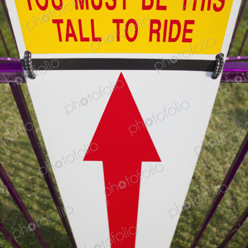 Height Requirment Sign In Front Of Amusement Park Ride
