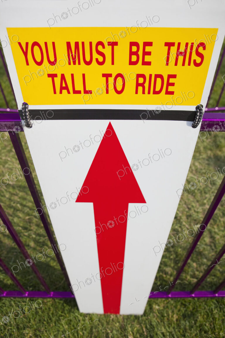 Height Requirment Sign In Front Of Amusement Park Ride