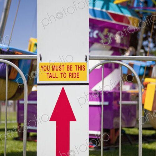 Height Requirment Sign In Front Of Amusement Park Ride Height Requirment Sign In Front Of Amusement Park Ride