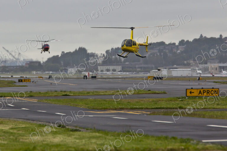 Helicopters Landing on a Runway