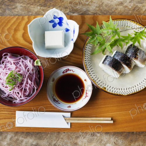 High angle close up of Sushi, Tofu, Noodles and Soy Sauce on a table in Japanese… High angle close up of Sushi, Tofu, Noodles and Soy Sauce on a table in Japanese…