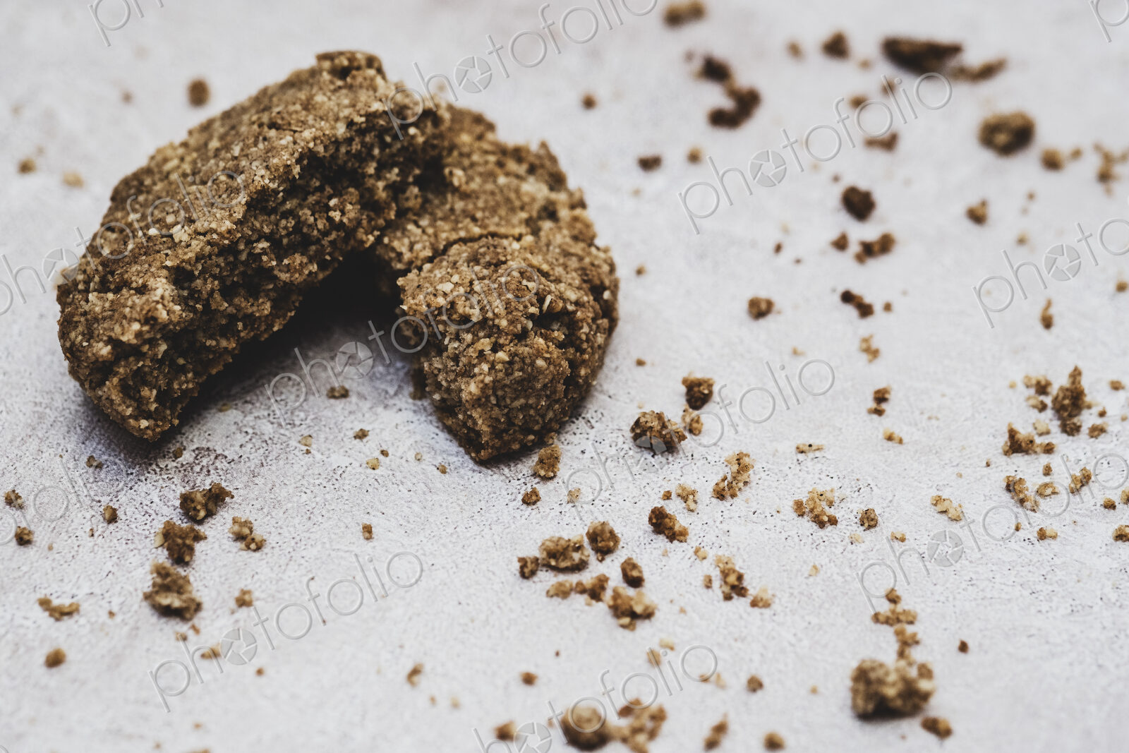 High angle close up of a freshly baked chocolate cookie broken in half.