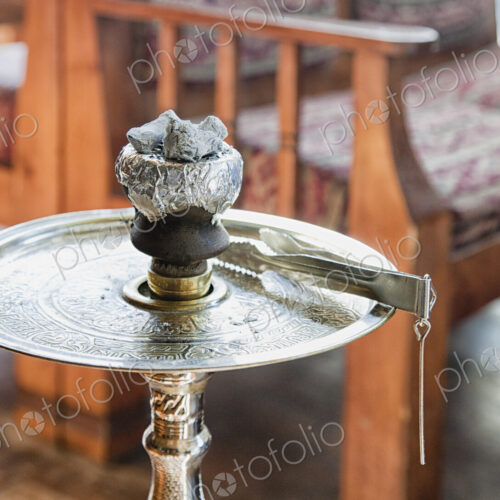 High angle close up of a hookah pipe on a metal table, Turkey. High angle close up of a hookah pipe on a metal table, Turkey.