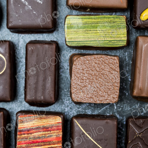 High angle close up of a selection of chocolate pralines. High angle close up of a selection of chocolate pralines.