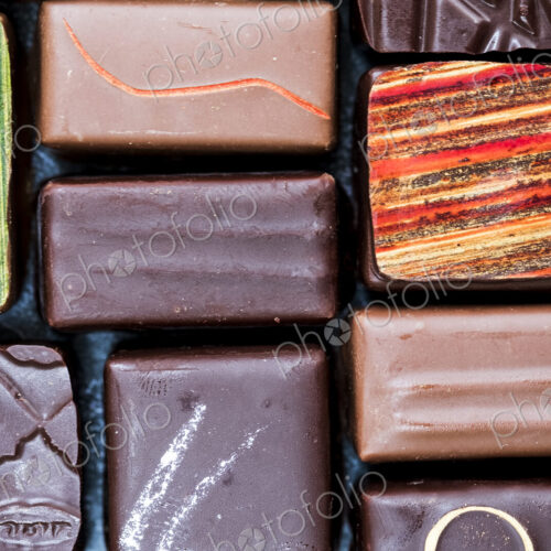 High angle close up of a selection of chocolate pralines. High angle close up of a selection of chocolate pralines.