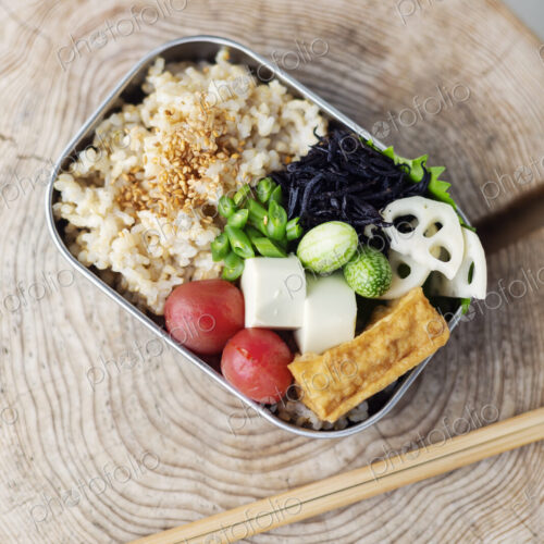 High angle close up of a selection of vegetarian Japanese foods in a cafe. High angle close up of a selection of vegetarian Japanese foods in a cafe.