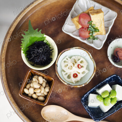High angle close up of a selection of vegetarian Japanese foods in a cafe. High angle close up of a selection of vegetarian Japanese foods in a cafe.