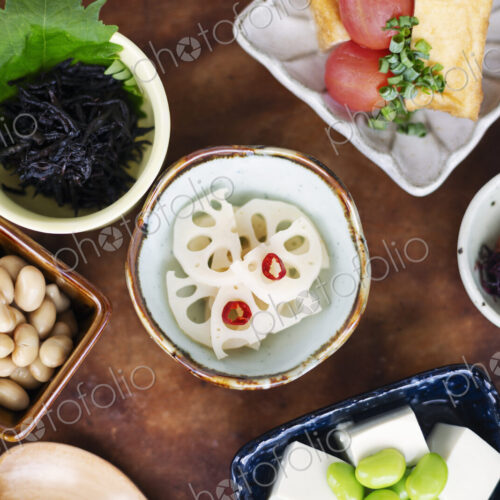 High angle close up of a selection of vegetarian Japanese foods in a cafe. High angle close up of a selection of vegetarian Japanese foods in a cafe.