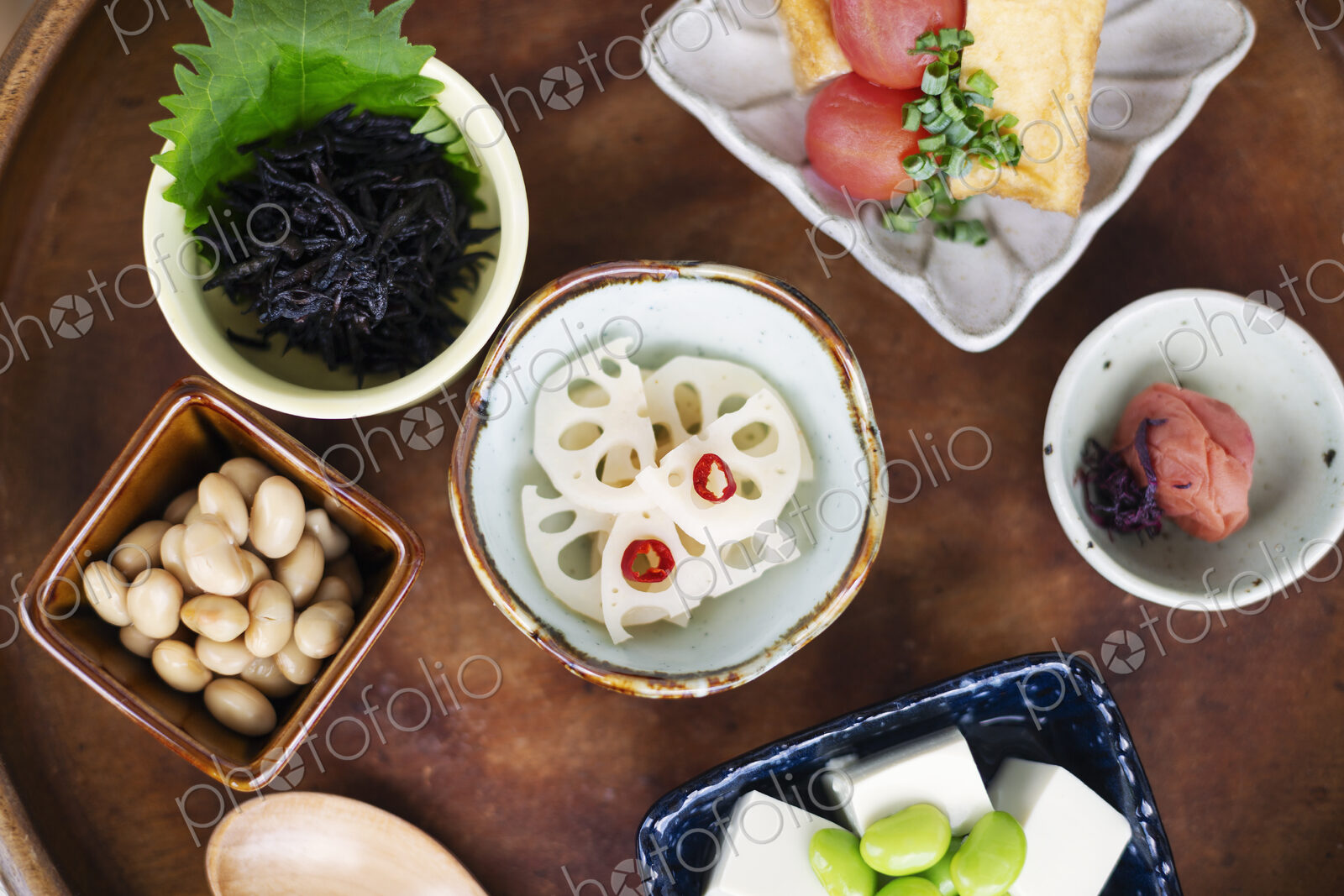 High angle close up of a selection of vegetarian Japanese foods in a cafe.