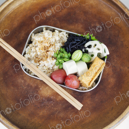 High angle close up of a selection of vegetarian Japanese foods in a cafe. High angle close up of a selection of vegetarian Japanese foods in a cafe.