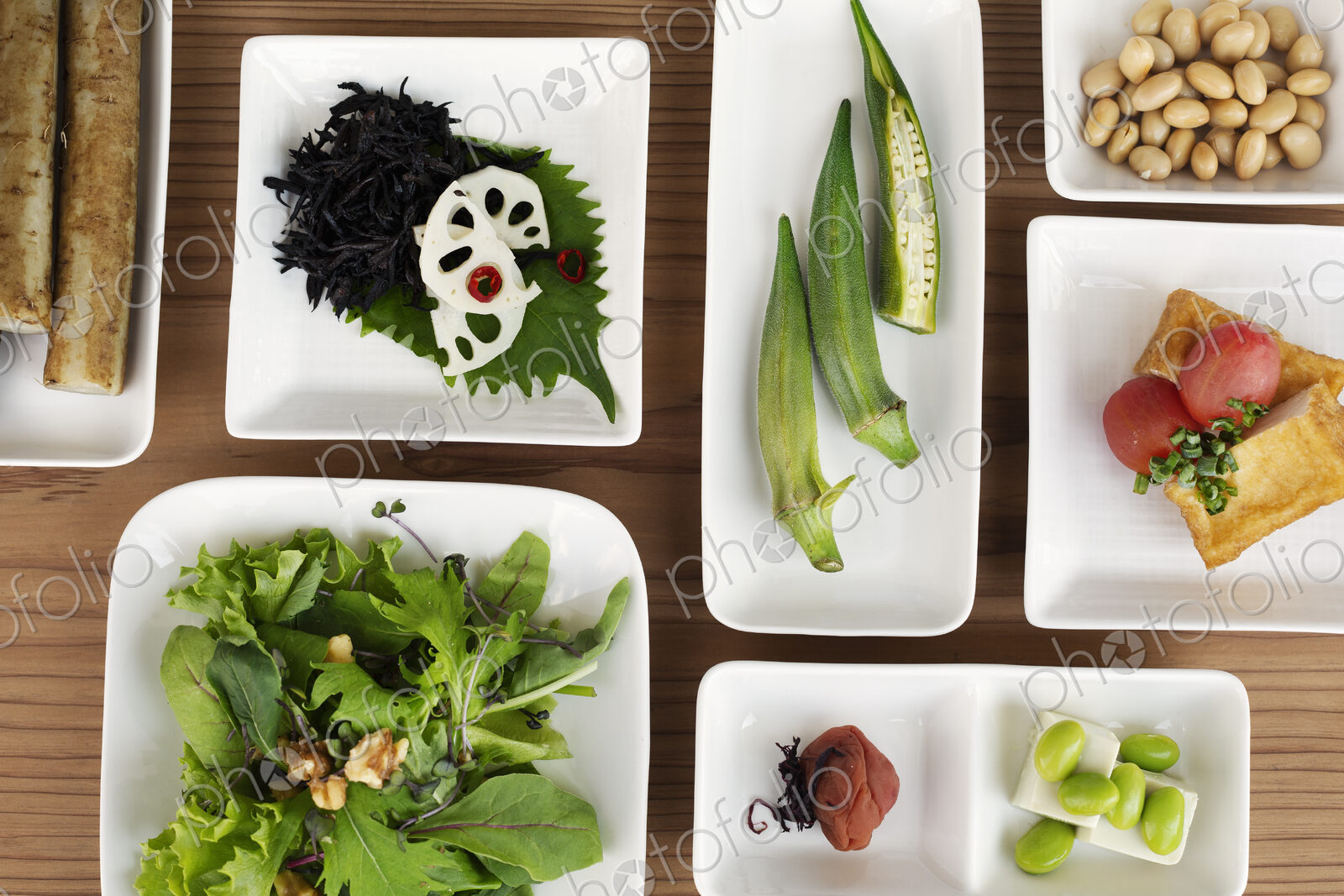 High angle close up of a selection of vegetarian Japanese foods in a cafe.