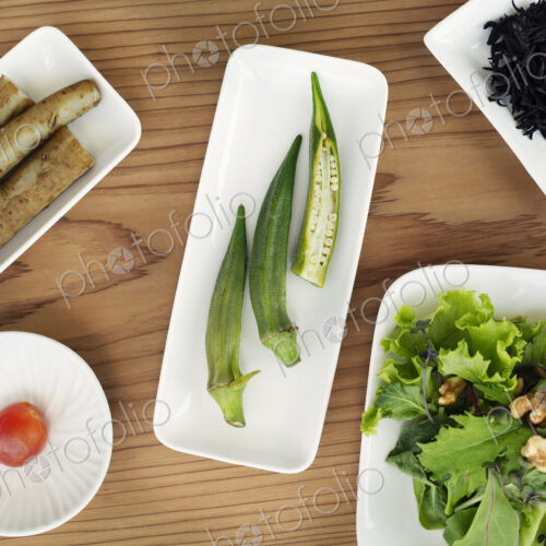 High angle close up of a selection of vegetarian Japanese foods in a cafe. High angle close up of a selection of vegetarian Japanese foods in a cafe.