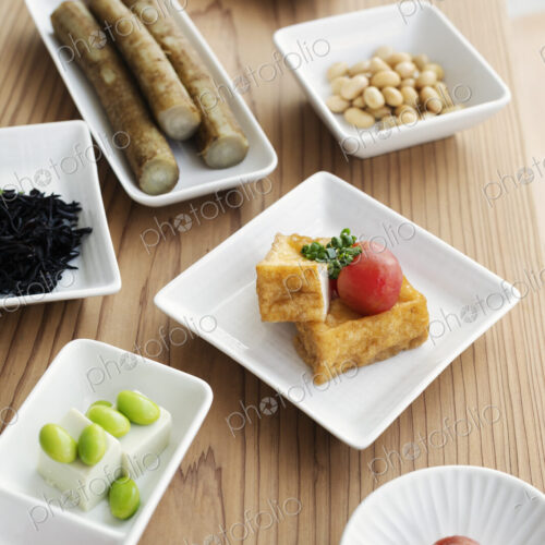 High angle close up of a selection of vegetarian Japanese foods in a cafe. High angle close up of a selection of vegetarian Japanese foods in a cafe.