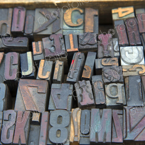 High angle close up of a selection of wood print keys in a variety of fonts. High angle close up of a selection of wood print keys in a variety of fonts.