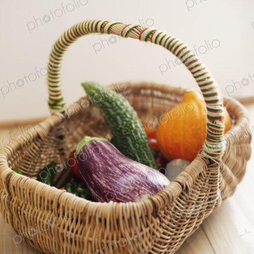 High angle close up of basket with fresh vegetables. High angle close up of basket with fresh vegetables.