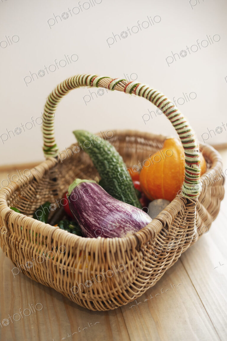 High angle close up of basket with fresh vegetables.