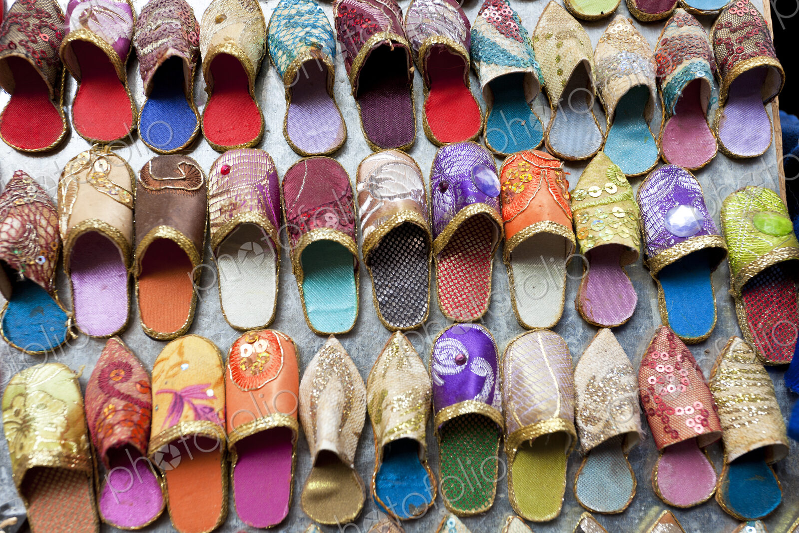 High angle close up of colourful leather slippers at a traditional North African market.