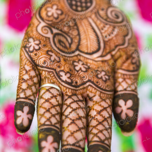High angle close up of female hand covered in Henna tattoos with intricate geometric,… High angle close up of female hand covered in Henna tattoos with intricate geometric,…