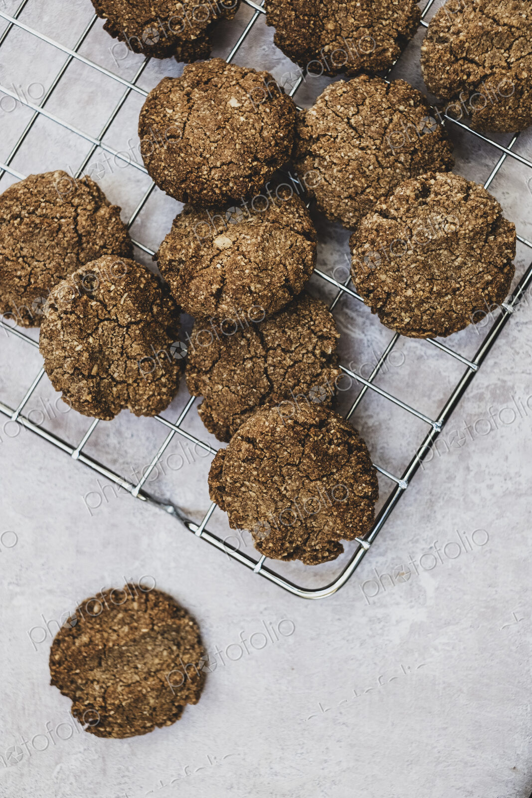 High angle close up of freshly baked chocolate cookies on a baking tray.