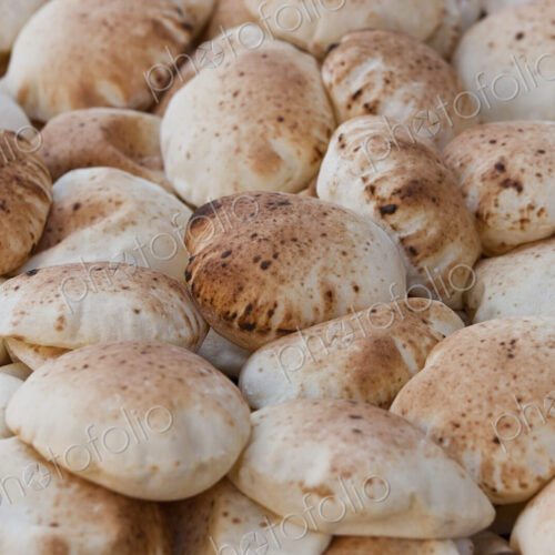 High angle close up of heap of traditional Egyptian Baladi breads. High angle close up of heap of traditional Egyptian Baladi breads.
