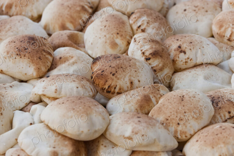 High angle close up of heap of traditional Egyptian Baladi breads.