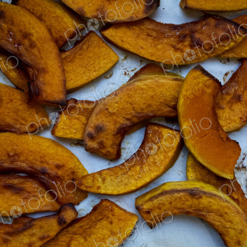 High angle close up of roasted apple slices in an artisan bakery.