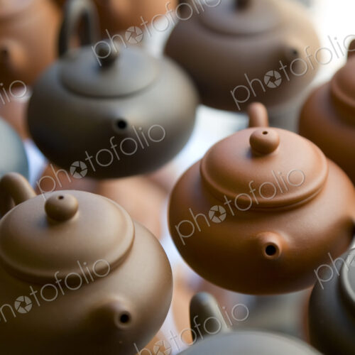 High angle close up of traditional brown clay teapots. High angle close up of traditional brown clay teapots.
