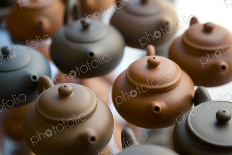 High angle close up of traditional brown clay teapots.